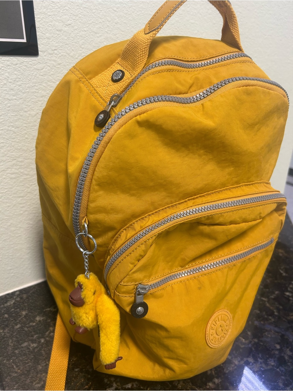 Kipling Mustard Yellow Nylon Mini Backpack with Monkey Charm